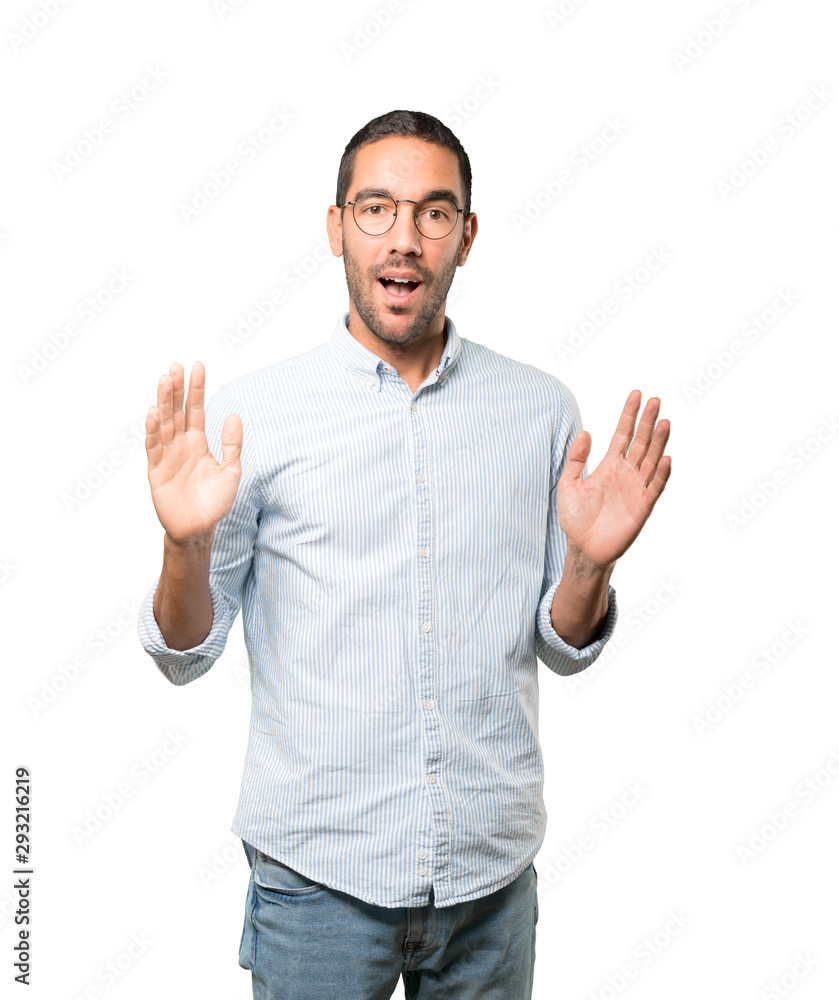 Friendly young man doing a gesture of admiration Friendly young man doing a gesture of admiration