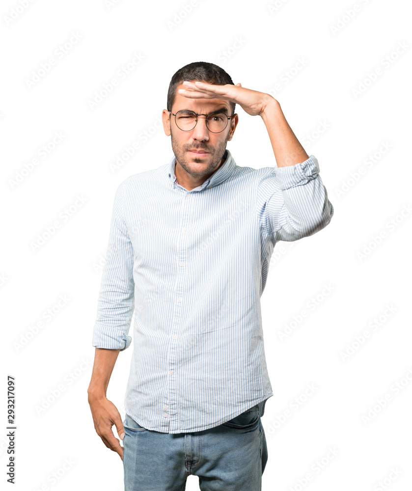 Concentrated young man with a gesture of looking away Concentrated young man with a gesture of looking away
