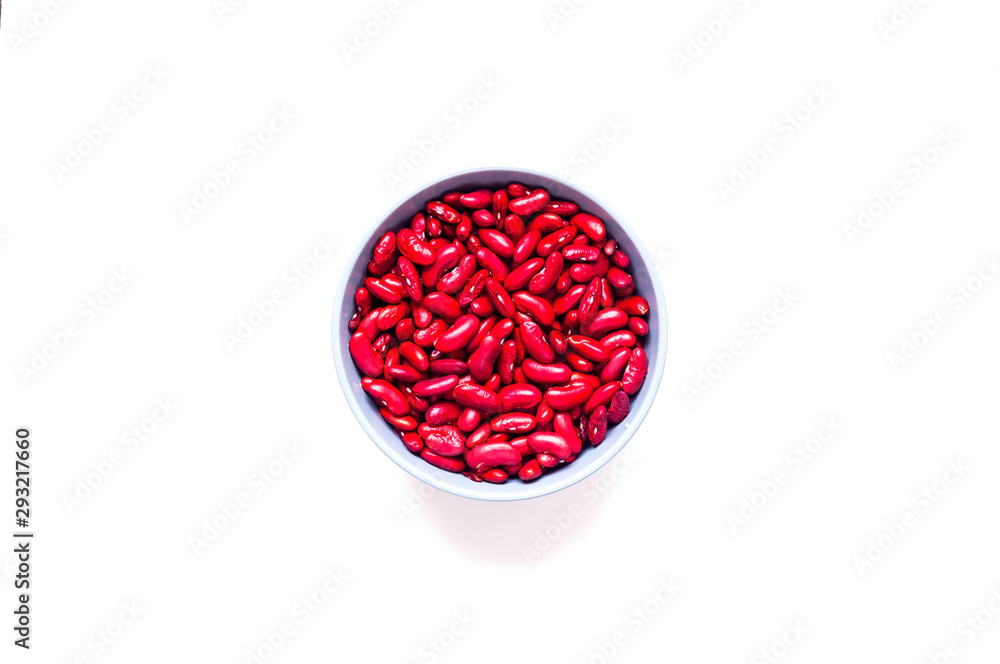 Beans in blue bowl on white isolated background. Mexican food ingredient. Close-up Beans in blue bowl on white isolated background. Mexican food ingredient. Close-up