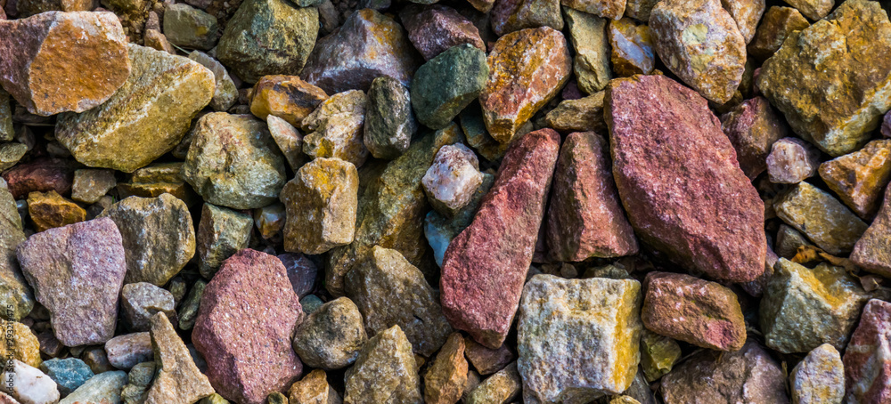 Naklejka macro closeup of gravel stones in diverse colors, rock pattern background