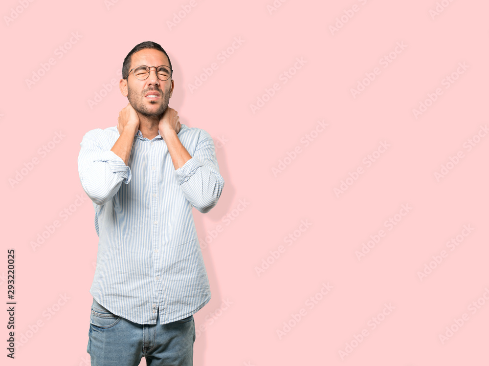 Concerned young man with a gesture of pain Concerned young man with a gesture of pain