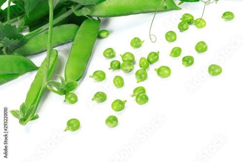Fresh green peas pods and green peas with sprouts on white background in close-up