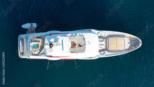 Aerial drone photo of luxury yacht docked in Mediterranean destination with deep blue sea at sunset © aerial-drone
