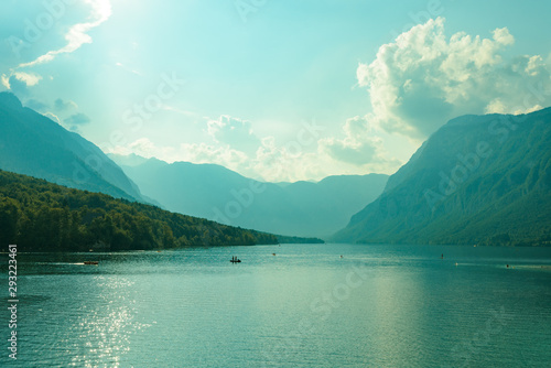 Lake Bohinj panorama with silhouettes of people
