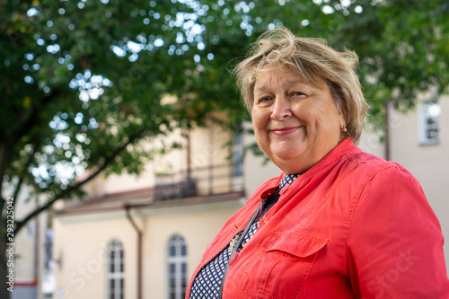 Mature woman walking around the old town. Tallinn