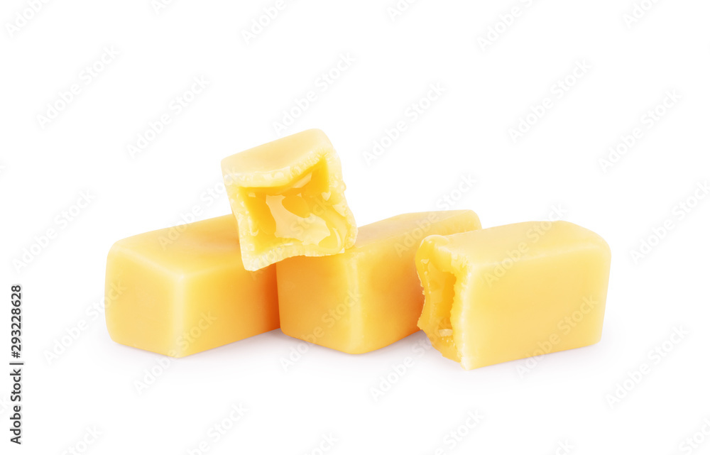 Caramel flows from candy on a white background Caramel flows from candy on a white background