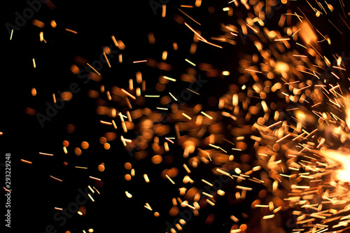 sparks and flame on black background