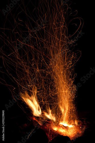 sparks and flame on black background