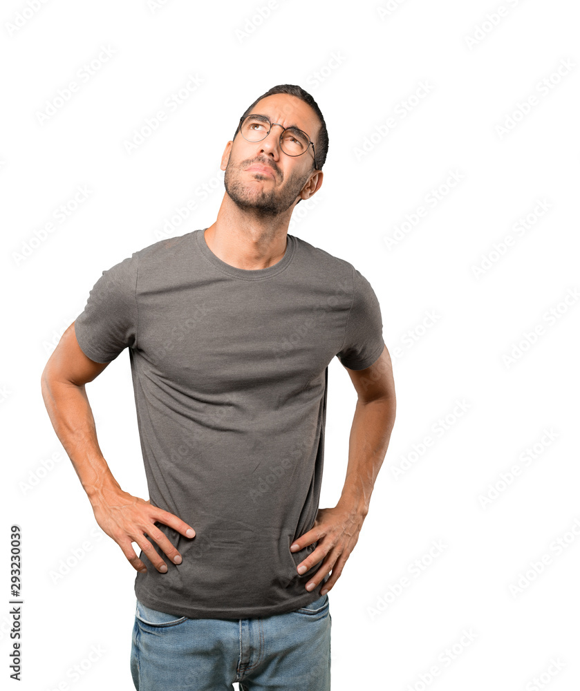 Fototapeta premium Hesitant young man looking gesture