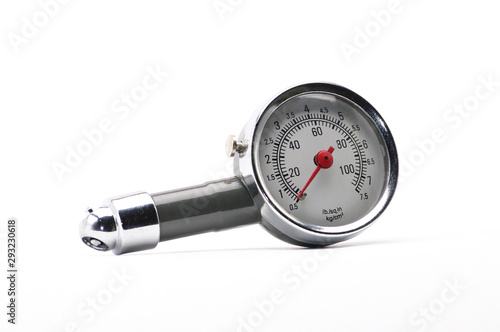 Pressure gauge for measuring air pressure in car tires on a white background