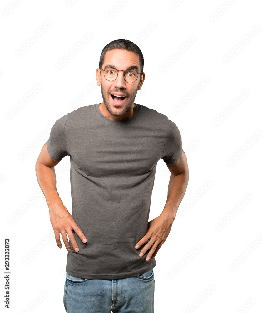 Fototapeta premium Amazed young man looking up gesture