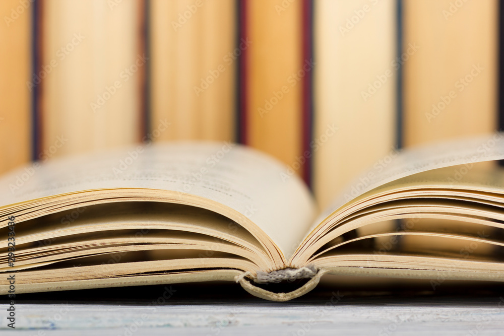Open book, hardback books on wooden table. Back to school. Copy space Open book, hardback books on wooden table. Back to school. Copy space