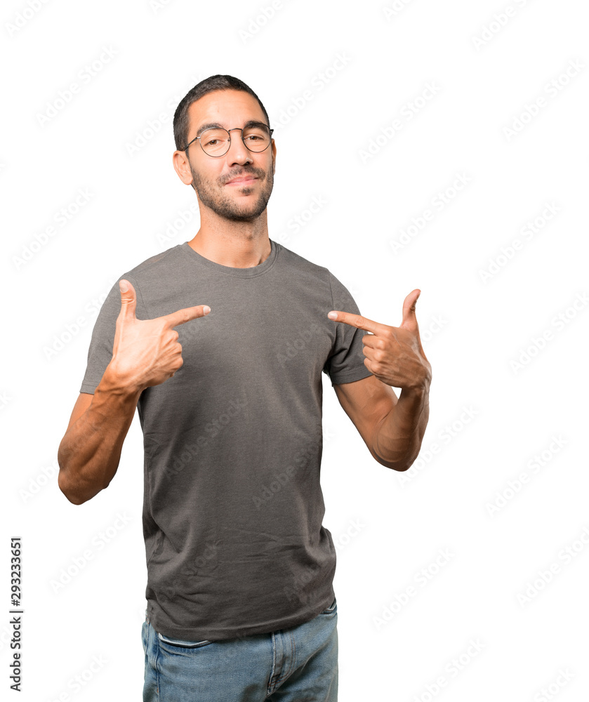 Proud young man making a haughty gesture Proud young man making a haughty gesture