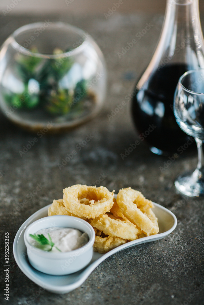 breaded squid rings with tartar sauce.  