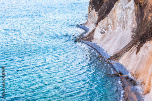 Blue Sea and Bold Coastal Cliffs / Huge eroded chalk cliffs at stony coast of Ruegen island, Germany (copy space)