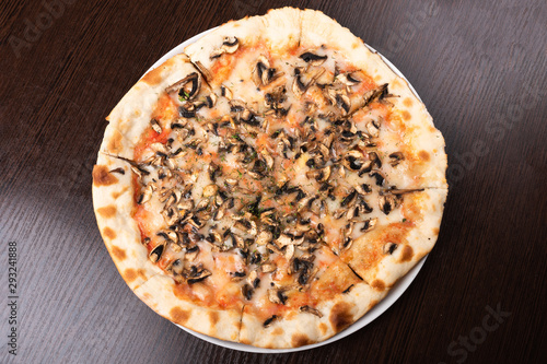 Bad, cheap pizza with mushrooms and cheese.