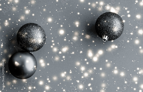 Photography Black Christmas baubles with snow glitter shine, luxury brand winter holiday car