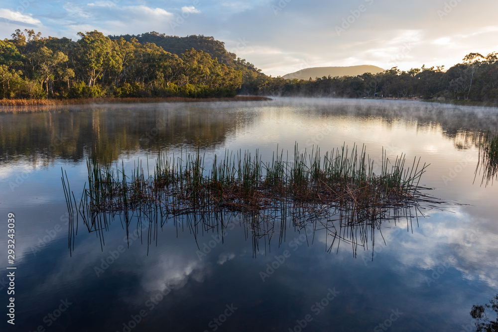 Sunrise at Dunn's Swamp. Australia outback sunrise with mist on the water.