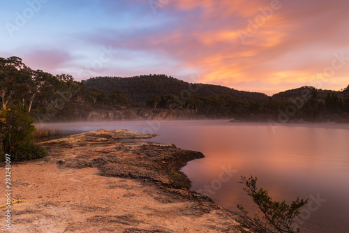 Sunrise at Dunn's Swamp. Australia outback sunrise with mist on the water.
