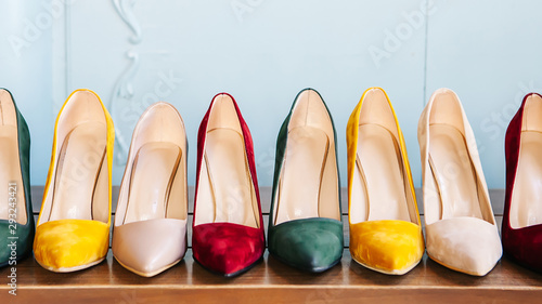 Women's shoes on the chair. Women's shoes with heels in various colors