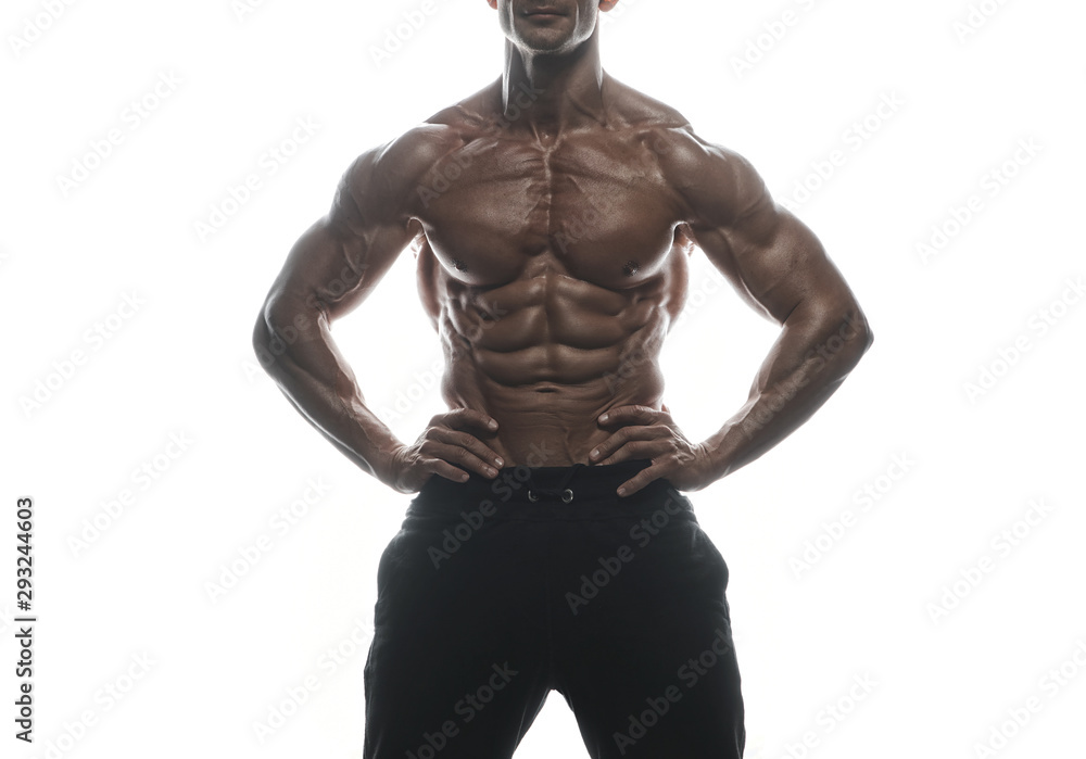 Fitness model man posing in studio Fitness model man posing in studio