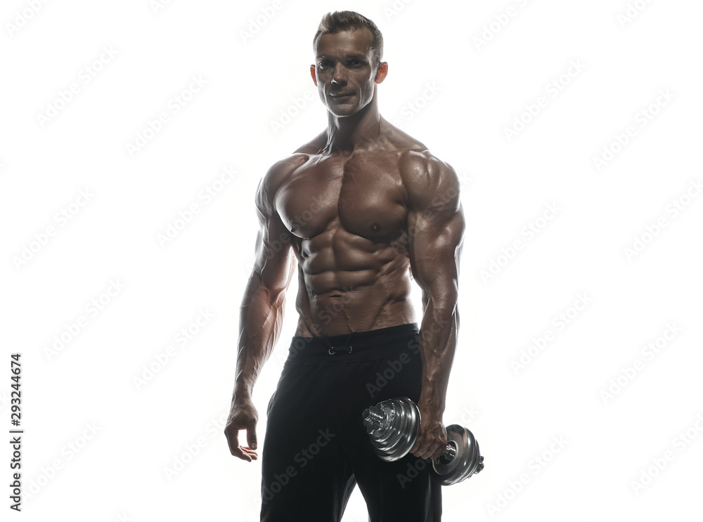 Fitness model man posing in studio Fitness model man posing in studio