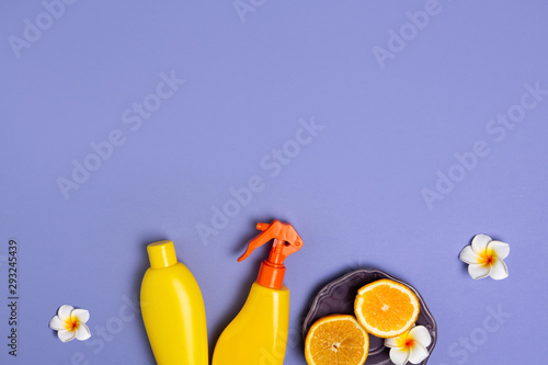 Summer subject photography. Yellow bottles of sunsceen lotion © Iryna