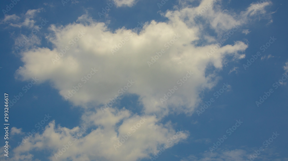 White clouds in the blue sky during