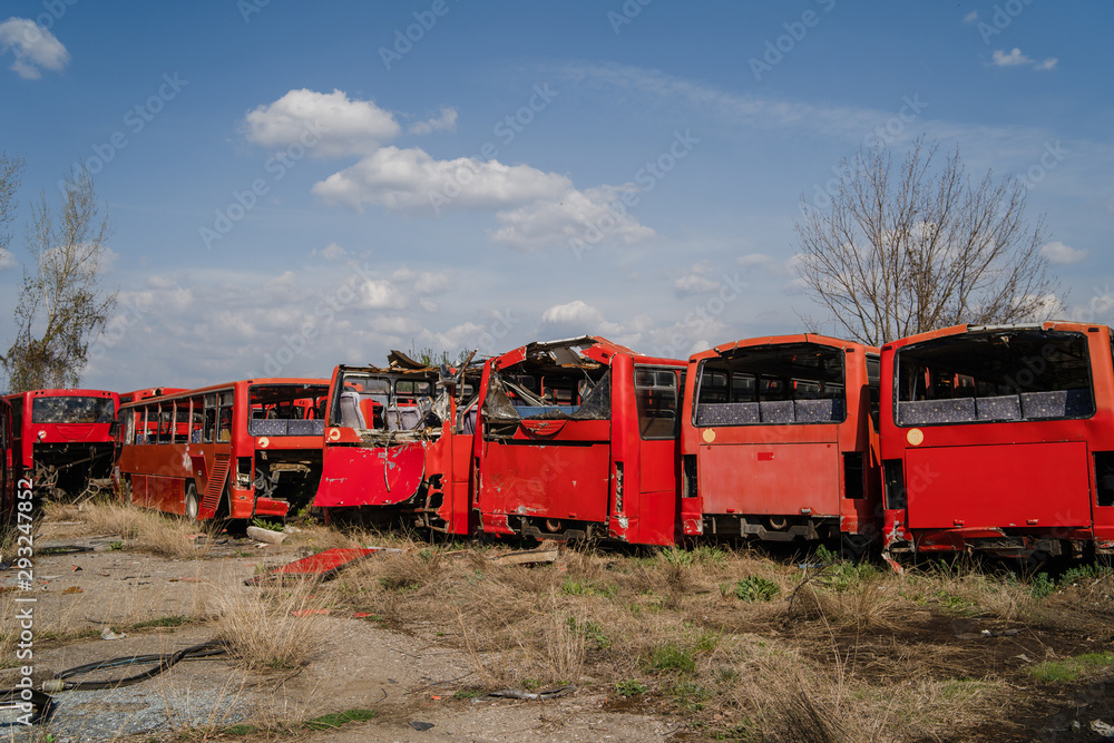 Disassembled bus after the accident used for parts wrecked broken red buses scrap for recycling Disassembled bus after the accident used for parts wrecked broken red buses scrap for recycling