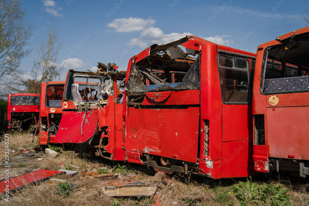 Disassembled bus after the accident used for parts wrecked broken red buses scrap for recycling Disassembled bus after the accident used for parts wrecked broken red buses scrap for recycling