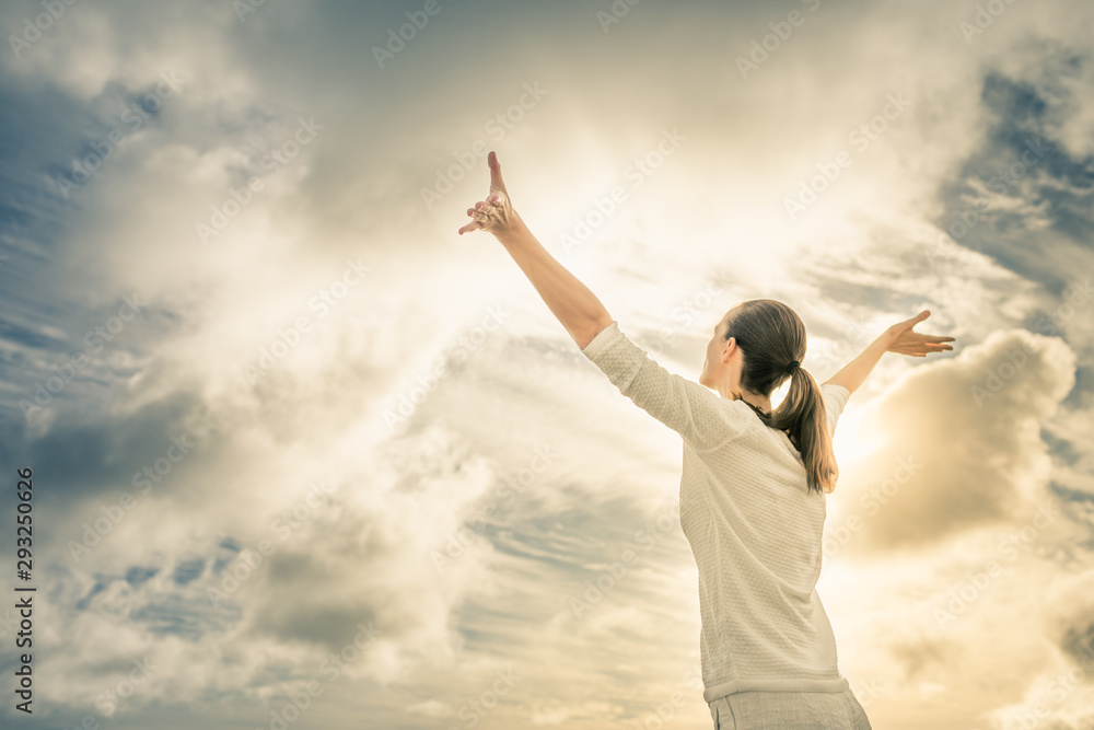 Woman feeling free and happy looking up to the sky Woman feeling free and happy looking up to the sky