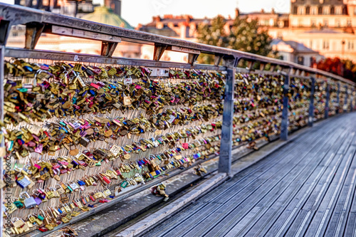 Architectural details and padlocks of a footbridge in Paris France