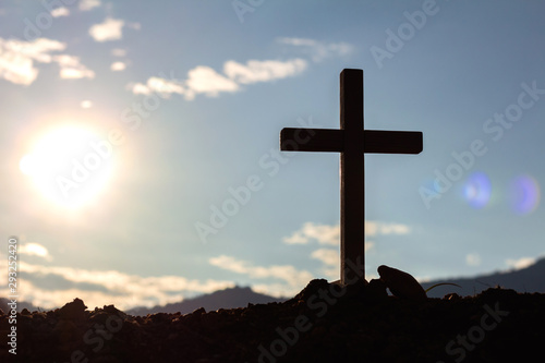 Silhouette cross on mountain at sunset background.Crucifixion Of Jesus Christ