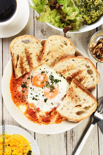 Sunny side up eggs with crsipy toast on the plate    photo