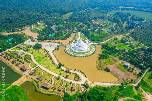 Fototapeta Naklejka Na Ścianę i Meble -  Aerial view of white pagoda at Wat Sangtham wangkaokaew at Wangnamkaew ,Nakornratchasrima,Thailand