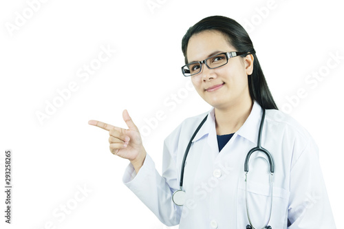 Smiling young female doctor pointing with finger.