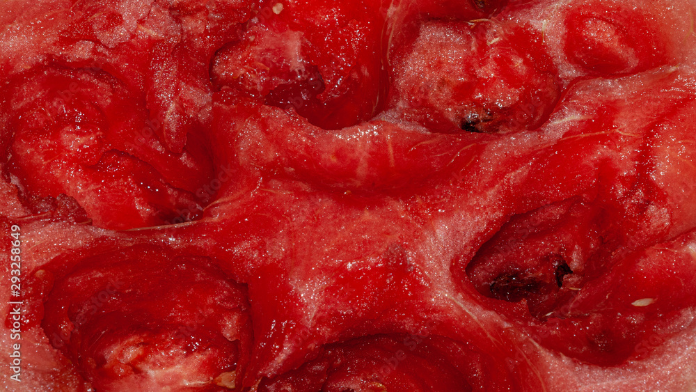 The flesh of a ripe watermelon as an abstract decorative background The flesh of a ripe watermelon as an abstract decorative background