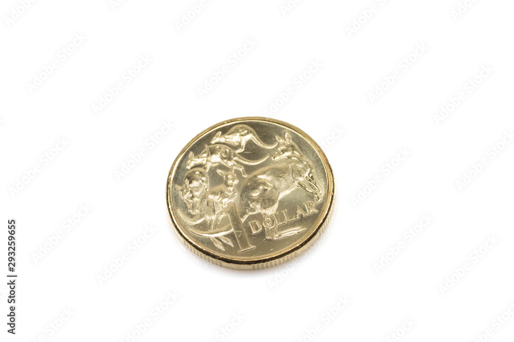 An isolated, gold Australian dollar coin, shot close up in macro on a white background. An isolated, gold Australian dollar coin, shot close up in macro on a white background.