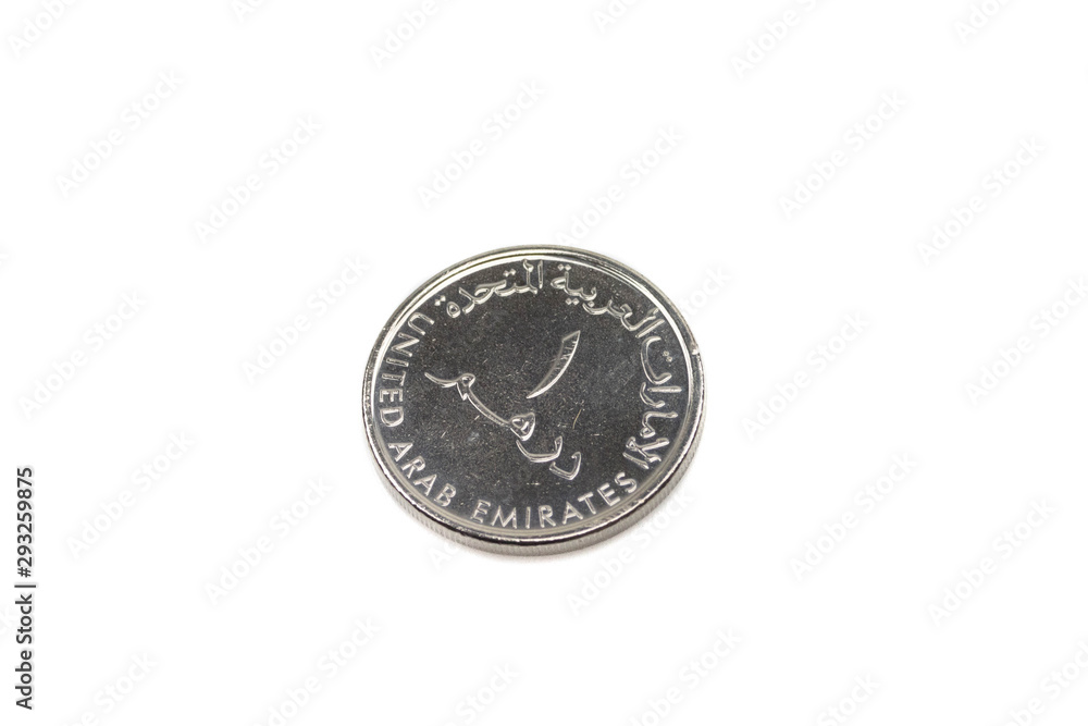 A close up, macro image of a one dirham coin from the United Arab Emirates shot against a white background A close up, macro image of a one dirham coin from the United Arab Emirates shot against a white background