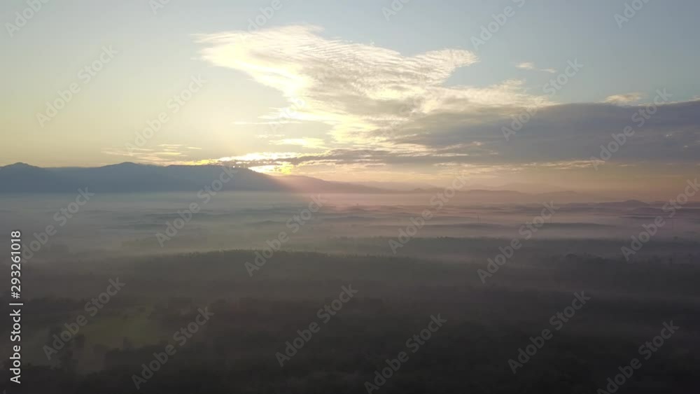 Aerial view sunray over the misty morning neae forest at MBI Desaku, Kulim, Kedah, Malaysia. Aerial view sunray over the misty morning neae forest at MBI Desaku, Kulim, Kedah, Malaysia.