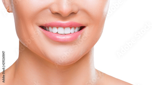Woman's smile with white healthy teeth, close up view - isolated on white background.
