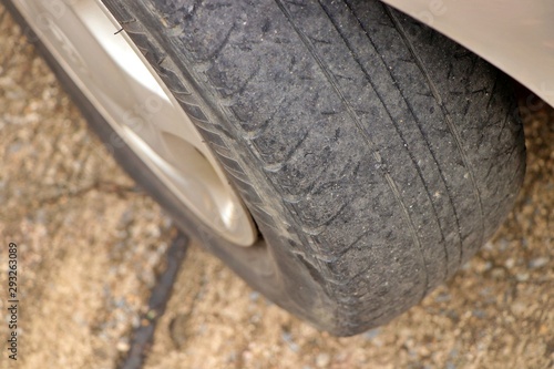 Worn out tyre concept. Danger of using a worn out tyre with very little tread remaining.