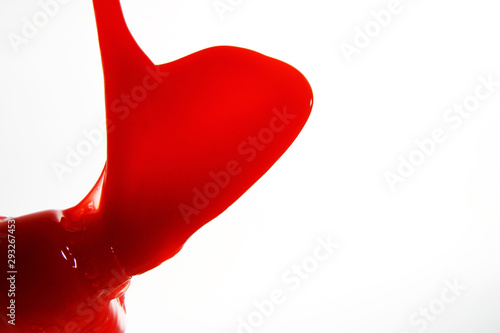 Red sauce on white background photo