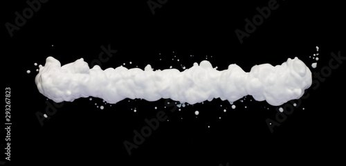 Shiny shaving foam line on black background