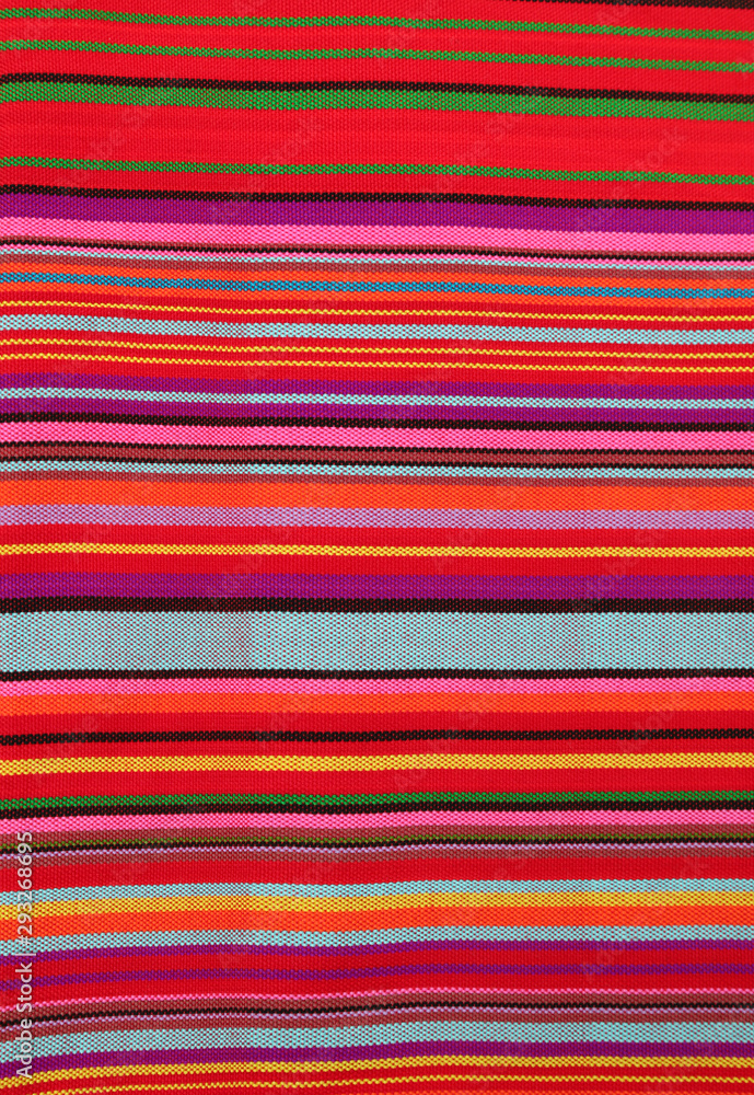 Closeup of colorful cotton cloth. A natural art background. Vertical view. Closeup of colorful cotton cloth. A natural art background. Vertical view.