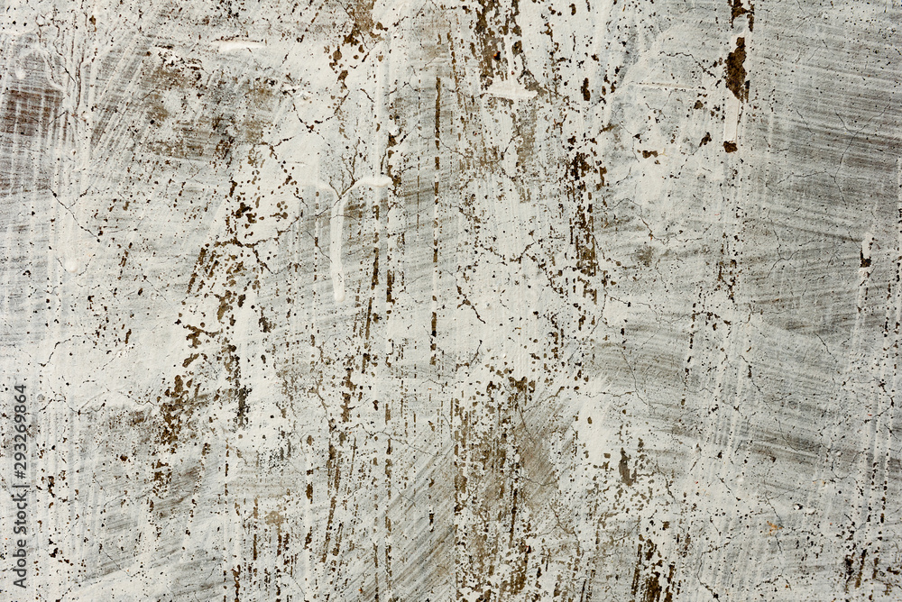 Fototapeta premium Texture of a concrete wall with cracks and scratches which can be used as a background