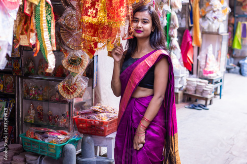Beautiful Indian woman shopping decorative products for Diwali and festive season 
