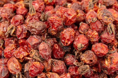 Heap of organic sun dried fruits berries dehydrated rose hip. Healthy diet ingredients concept. Creative food poster.