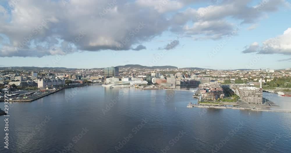 Cinema 4K drone shot with parallax motion of the new Bjørvika district, with the Lambda Munch Museum, Opera House and Sørenga in a sunset in autumn fall, in Oslo Norway. Cinema 4K drone shot with parallax motion of the new Bjørvika district, with the Lambda Munch Museum, Opera House and Sørenga in a sunset in autumn fall, in Oslo Norway.