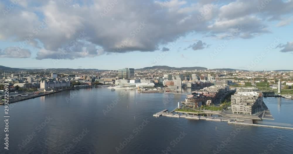 Cinema 4K drone shot with parallax motion of the new Bjørvika quarter, with the Lambda Munch Museum, Oslo Opera House and Sørenga in clear daylight in autumn fall, in Oslo Norway. Cinema 4K drone shot with parallax motion of the new Bjørvika quarter, with the Lambda Munch Museum, Oslo Opera House and Sørenga in clear daylight in autumn fall, in Oslo Norway.